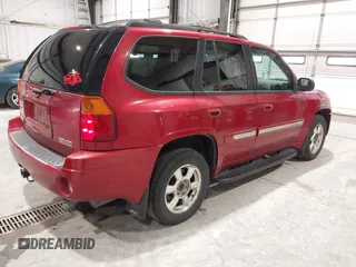 2005 GMC Envoy SLT with VIN 1GKDT13S352324863, listed as a IAAI auction lot 41707649 with 247,326 mi miles. Bid and sale history available at carsss.com. Image 4.