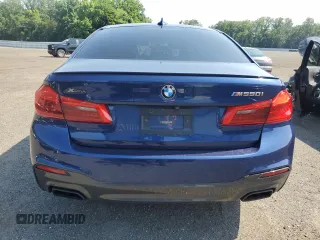 2020 BMW 5 Series M550i xDrive with VIN WBAJS7C0XLBN96338, listed as a Copart auction lot 60591815 with 73,910 mi miles and Salvage title. Bid and sale history available at DreamBid. Image 6.