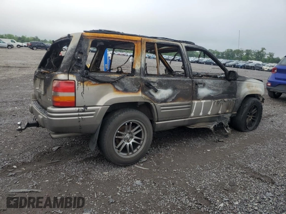 1998 Jeep Grand Cherokee Limited z VIN 1J4GZ88ZXWC255195, wystawiony jako Copart lot #55817705 z przebiegiem Nie podano mil oraz Nie do naprawy • Non repairable. Historia ofert i sprzedaży dostępna na DreamBid. Obrazek 3.