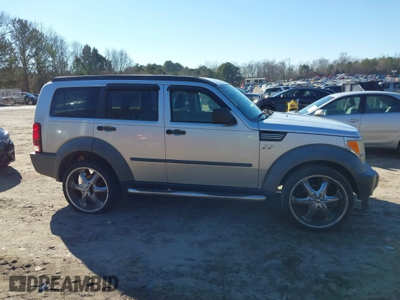 2007 Dodge Nitro SXT with VIN 1D8GT28K97W642118, listed as a IAAI auction lot 41276172 with 385,441 mi miles. Bid and sale history available at carsss.com. Image 13.