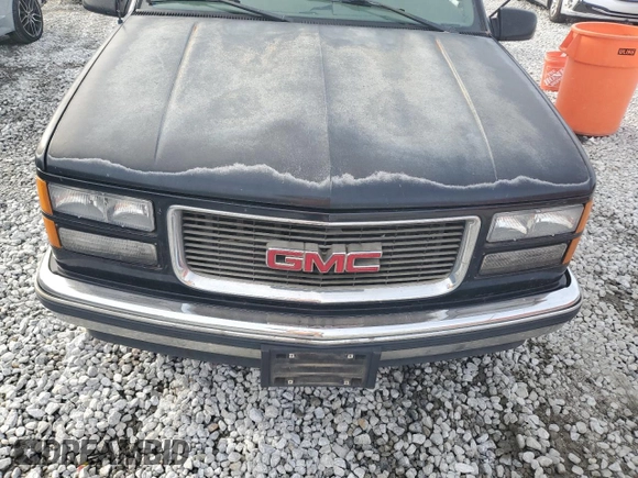 1999 GMC Yukon with VIN 1GKEC13R7XJ802387, listed as a Copart auction lot 82819934 with 438,574 mi miles and Salvage Title. Bid and sale history available at carsss.com. Image 12.
