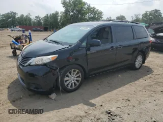 2015 Toyota Sienna LE with VIN 5TDJK3DC1FS112266, listed as a Copart auction lot 60744095 with 84,619 mi miles and Salvage title. Bid and sale history available at DreamBid. Image 1.