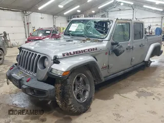 2020 Jeep Gladiator Rubicon with VIN 1C6JJTBGXLL136627, listed as a IAAI auction lot 42333468 with 74,717 mi miles and . Bid and sale history available at DreamBid. Image 2.
