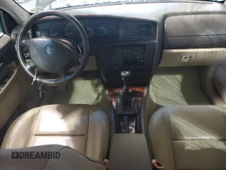2000 Cadillac Catera z VIN W06VR54R7YR124650, wystawiony jako Copart lot #49602314 z przebiegiem 77 800 mil mil oraz Nie do naprawy. Historia ofert i sprzedaży dostępna na DreamBid. Obrazek 8.