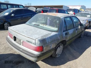1992 Chevrolet Corsica LT z VIN 1G1LT53T9NY154246, wystawiony jako IAAI lot #41834072 z przebiegiem 87 587 mil mil oraz . Historia ofert i sprzedaży dostępna na DreamBid. Obrazek 4.