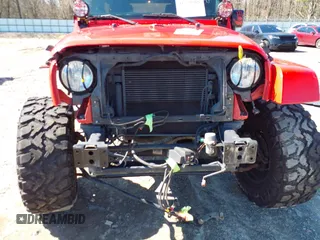 2015 Jeep Wrangler Unlimited Sahara with VIN 1C4BJWEG1FL748732, listed as a IAAI auction lot 41779308 with 109,986 mi miles. Bid and sale history available at carsss.com. Image 6.