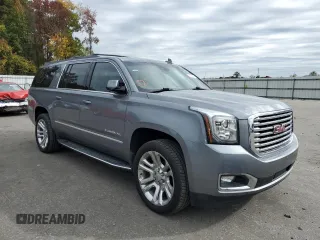 2019 GMC Yukon XL SLT with VIN 1GKS2GKCXKR268690, listed as a Copart auction lot 64790742 with 73,492 mi miles and Salvage title. Bid and sale history available at DreamBid. Image 1.