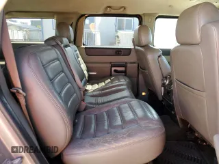 2003 Hummer H2 z VIN 5GRGN23U33H102150, wystawiony jako Copart lot #56997295 z przebiegiem Nie podano mil oraz Tytuł czysty. Historia ofert i sprzedaży dostępna na DreamBid. Obrazek 11.