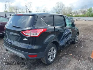 2013 Ford Escape SE with VIN 1FMCU0GX1DUA99040, listed as a IAAI auction lot 42084787 with 140,473 mi miles and . Bid and sale history available at DreamBid. Image 4.