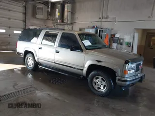 1999 GMC Suburban with VIN 3GKFK16R7XG549530, listed as a IAAI auction lot 41778323 with 174,866 mi miles. Bid and sale history available at carsss.com. Image 1.