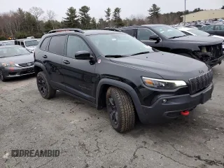 2022 Jeep Cherokee Trailhawk with VIN 1C4PJMBX3ND502322, listed as a Copart auction lot 85561444 with 57,630 mi miles and Salvage Title. Bid and sale history available at carsss.com. Image 4.