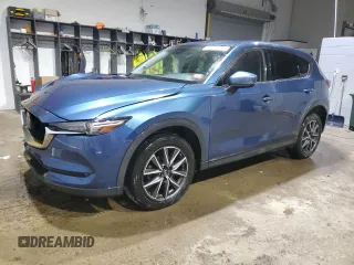 2018 Mazda CX-5 Grand Touring with VIN JM3KFBDM1J0304706, listed as a Copart auction lot 46123415 with 104,004 mi miles and Salvage title. Bid and sale history available at DreamBid. Image 1.