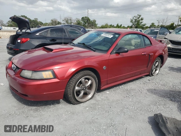 2004 Ford Mustang GT Deluxe with VIN 1FAFP42X64F174672, listed as a Copart auction lot 59902025 with 83,386 mi miles and Salvage title. Bid and sale history available at DreamBid. Image 1.