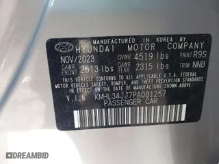 2023 Hyundai Sonata Hybrid SEL with VIN KMHL34JJ7PA081257, listed as a IAAI auction lot 41160978 with 12,057 mi miles. Bid and sale history available at carsss.com. Image 9.