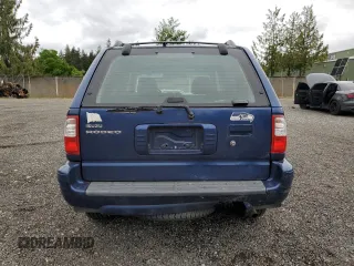 2002 Isuzu Rodeo S with VIN 4S2CK58W124301647, listed as a Copart auction lot 56973895 with 129,009 mi miles and Salvage title. Bid and sale history available at DreamBid. Image 6.