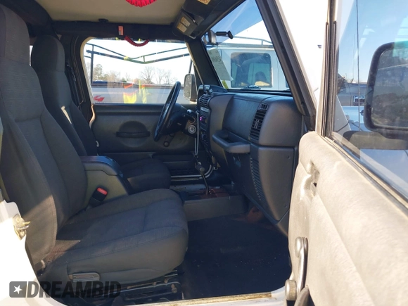 2005 Jeep Wrangler Unlimited with VIN 1J4FA44SX5P316055, listed as a IAAI auction lot 41586898 with 218,181 mi miles. Bid and sale history available at carsss.com. Image 5.
