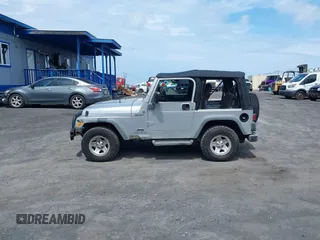2004 Jeep Wrangler Sport with VIN 1J4FA49S04P781581, listed as a IAAI auction lot 42078693 with 111,123 mi miles and . Bid and sale history available at DreamBid. Image 14.