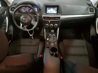 2016 Mazda CX-5 Touring z VIN JM3KE4CY7G0898598, wystawiony jako Copart lot #56717895 z przebiegiem 103 548 mil mil oraz Szkoda całkowita • Salvage title. Historia ofert i sprzedaży dostępna na DreamBid. Obrazek 8.