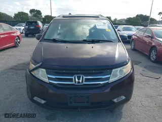 2011 Honda Odyssey Touring with VIN 5FNRL5H97BB008759, listed as a IAAI auction lot 41567010 with 215,709 mi miles. Bid and sale history available at carsss.com. Image 12.