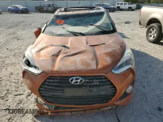 2015 Hyundai Veloster Turbo z VIN KMHTC6AE4FU232597, wystawiony jako Copart lot #74137024 z przebiegiem Nie podano mil oraz Szkoda całkowita • Salvage title. Historia ofert i sprzedaży dostępna na DreamBid. Obrazek 5.