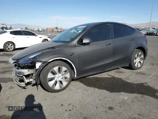 2023 Tesla Model Y Long Range z VIN 7SAYGAEE4PF670755, wystawiony jako Copart lot #55177345 z przebiegiem 63 051 mil mil oraz Szkoda całkowita • Salvage title. Historia ofert i sprzedaży dostępna na DreamBid. Obrazek 1.
