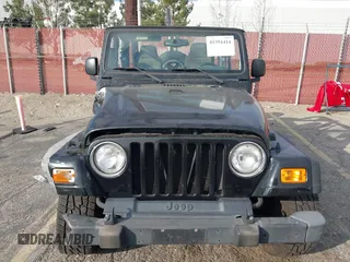 2003 Jeep Wrangler Sport with VIN 1J4FA49S23P328867, listed as a IAAI auction lot 41354414 with 96,703 mi miles. Bid and sale history available at carsss.com. Image 12.