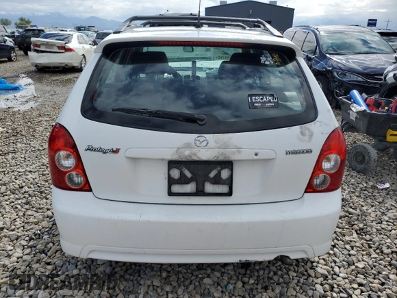 2002 Mazda Protege z VIN JM1BJ245721470434, wystawiony jako Copart lot #57293765 z przebiegiem 144 622 mil mil oraz Szkoda całkowita • Salvage title. Historia ofert i sprzedaży dostępna na DreamBid. Obrazek 6.