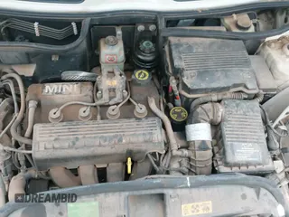 2006 MINI Hardtop with VIN WMWRC33576TJ77334, listed as a IAAI auction lot 41504165 with 83,186 mi miles and . Bid and sale history available at DreamBid. Image 12.