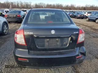2012 Suzuki SX4 LE with VIN JS2YC5A32C6302316, listed as a Copart auction lot 81703544 with 87,411 mi miles and Salvage Title. Bid and sale history available at carsss.com. Image 6.