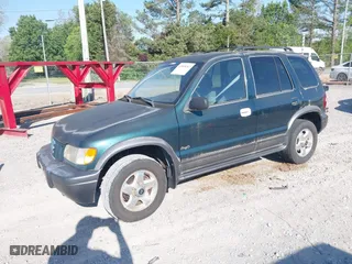 2002 Kia Sportage with VIN KNDJA723425144951, listed as a IAAI auction lot 42049262 with 149,793 mi miles. Bid and sale history available at carsss.com. Image 2.