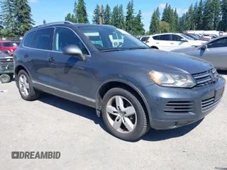 2012 Volkswagen Touareg Sport with VIN WVGFK9BP0CD004951, listed as a IAAI auction lot 42724125 with 173,993 mi miles and . Bid and sale history available at DreamBid. Image 1.