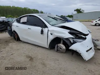 2021 Tesla Model Y Standard Range z VIN 5YJYGDED1MF109091, wystawiony jako Copart lot #50414004 z przebiegiem Nie podano mil oraz Szkody całkowita. Historia ofert i sprzedaży dostępna na DreamBid. Obrazek 4.