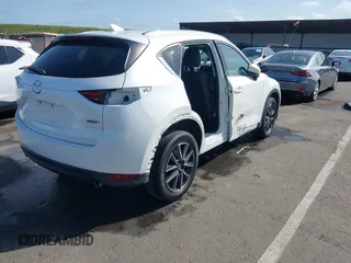 2017 Mazda CX-5 Grand Touring with VIN JM3KFADLXH0222341, listed as a IAAI auction lot 41990464 with 94,374 mi miles and . Bid and sale history available at carsss.com. Image 4.