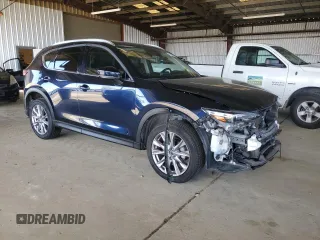 2019 Mazda CX-5 Grand Touring with VIN JM3KFADM3K1539890, listed as a Copart auction lot 57809835 with 56,079 mi miles and Salvage title. Bid and sale history available at DreamBid. Image 4.