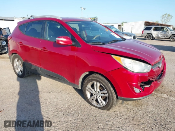 2013 Hyundai Tucson GLS with VIN KM8JU3AC6DU763590, listed as a IAAI auction lot 41999555 with 149,960 mi miles. Bid and sale history available at carsss.com. Image 1.
