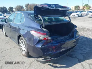 2022 Toyota Camry Hybrid LE with VIN 4T1C31AK7NU042879, listed as a IAAI auction lot 41729943 with 83,941 mi miles. Bid and sale history available at carsss.com. Image 4.