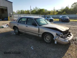 1997 Mercury Grand Marquis LS with VIN 2MELM75W3VX692074, listed as a Copart auction lot 52542335 with 211,850 mi miles and Salvage Title. Bid and sale history available at DreamBid. Image 4.