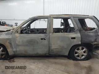 2005 GMC Envoy SLT z VIN 1GKDT13S752254350, wystawiony jako IAAI lot #41301432 z przebiegiem Nie podano mil oraz . Historia ofert i sprzedaży dostępna na DreamBid. Obrazek 14.