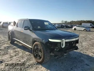 2023 Rivian R1T Adventure z VIN 7FCTGAAA1PN022134, wystawiony jako Copart lot #85545774 z przebiegiem 48 951 mil mil oraz Szkoda całkowita • Salvage title. Historia ofert i sprzedaży dostępna na DreamBid. Obrazek 11.