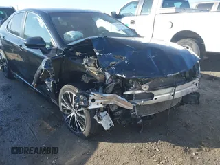 2018 Toyota Camry LE z VIN 4T1B11HK4JU151656, wystawiony jako IAAI lot #41524694 z przebiegiem 52 581 mil mil oraz . Historia ofert i sprzedaży dostępna na DreamBid. Obrazek 6.