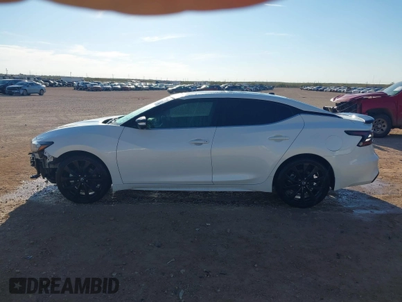 2020 Nissan Maxima SR with VIN 1N4AA6EVXLC365710, listed as a IAAI auction lot 40969464 with 74,320 mi miles and . Bid and sale history available at DreamBid. Image 14.