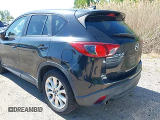 2013 Mazda CX-5 Grand Touring with VIN JM3KE4DE6D0127601, listed as a IAAI auction lot 42143558 with 95,719 mi miles and . Bid and sale history available at DreamBid. Image 6.