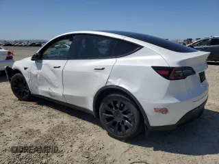 2023 Tesla Model Y Long Range z VIN 7SAYGDEE2PA061792, wystawiony jako Copart lot #52106965 z przebiegiem 11 968 mil mil oraz Szkoda całkowita • Salvage title. Historia ofert i sprzedaży dostępna na DreamBid. Obrazek 2.