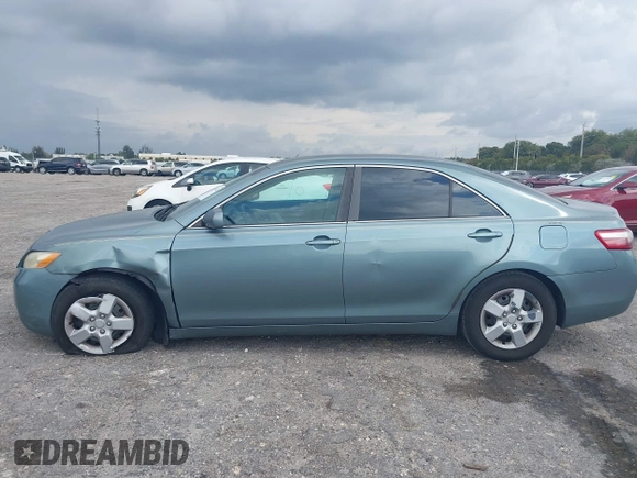 2007 Toyota Camry CE with VIN 4T1BE46K37U569515, listed as a IAAI auction lot 41974482 with 242,042 mi miles. Bid and sale history available at carsss.com. Image 14.