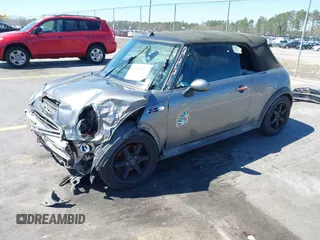 2005 MINI Convertible S with VIN WMWRH33545TF85051, listed as a IAAI auction lot 41843147 with 109,656 mi miles and . Bid and sale history available at DreamBid. Image 2.