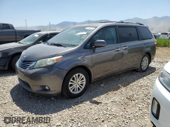 2011 Toyota Sienna XLE AAS with VIN 5TDYK3DCXBS134341, listed as a Copart auction lot 61602705 with 184,959 mi miles and Clean title. Bid and sale history available at DreamBid. Image 1.