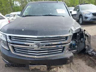 2015 Chevrolet Suburban LTZ with VIN 1GNSKKKC6FR637086, listed as a IAAI auction lot 42104826 with 79,986 mi miles and . Bid and sale history available at DreamBid. Image 12.