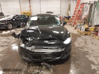 2014 Ford Fusion Titanium Hybrid with VIN 3FA6P0RUXER355654, listed as a IAAI auction lot 41611653 with 211,353 mi miles. Bid and sale history available at carsss.com. Image 6.