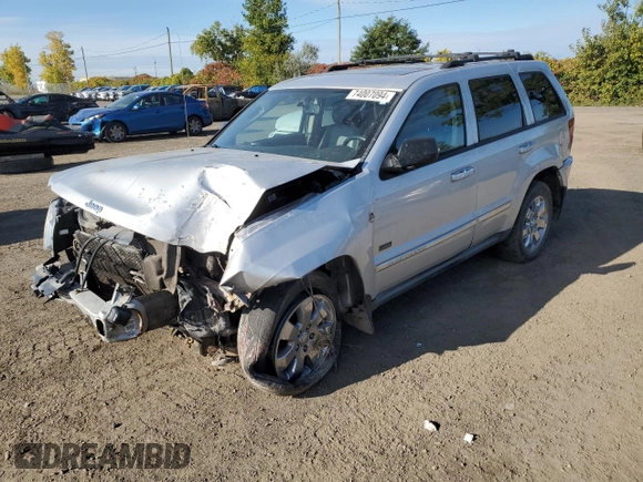 2009 Jeep Grand Cherokee Laredo with VIN 1J8HR48P39C559192, listed as a Copart auction lot 74007094 with 105,997 mi miles and Salvage Title. Bid and sale history available at carsss.com. Image 1.