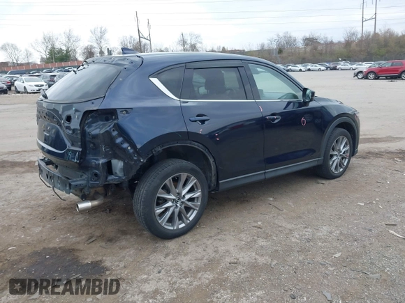 2021 Mazda CX-5 Grand Touring with VIN JM3KFADM0M1321375, listed as a IAAI auction lot 41913449 with 88,178 mi miles. Bid and sale history available at carsss.com. Image 4.